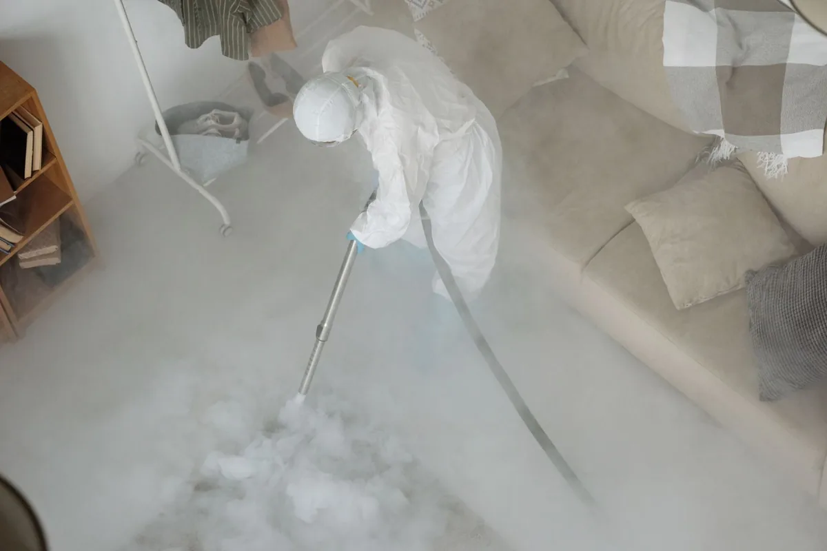 Biohazard cleanup technician in protective equipment, Junction City, CA